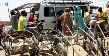 Urban Transport in Chad: Motorcycle taxi drivers await customers