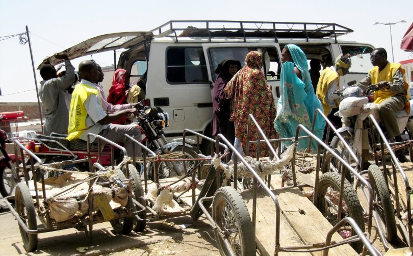 Urban Transport in Chad: Motorcycle taxi drivers await customers