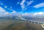The world's longest cable-stayed bridge, the Hutong (Shanghai-Nantong) Yangtze River Bridge, is under construction on the Yangtze River in Nantong