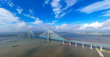 The world's longest cable-stayed bridge, the Hutong (Shanghai-Nantong) Yangtze River Bridge, is under construction on the Yangtze River in Nantong