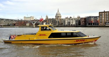 dhl-express-riverboat-on-river-with-st-pauls